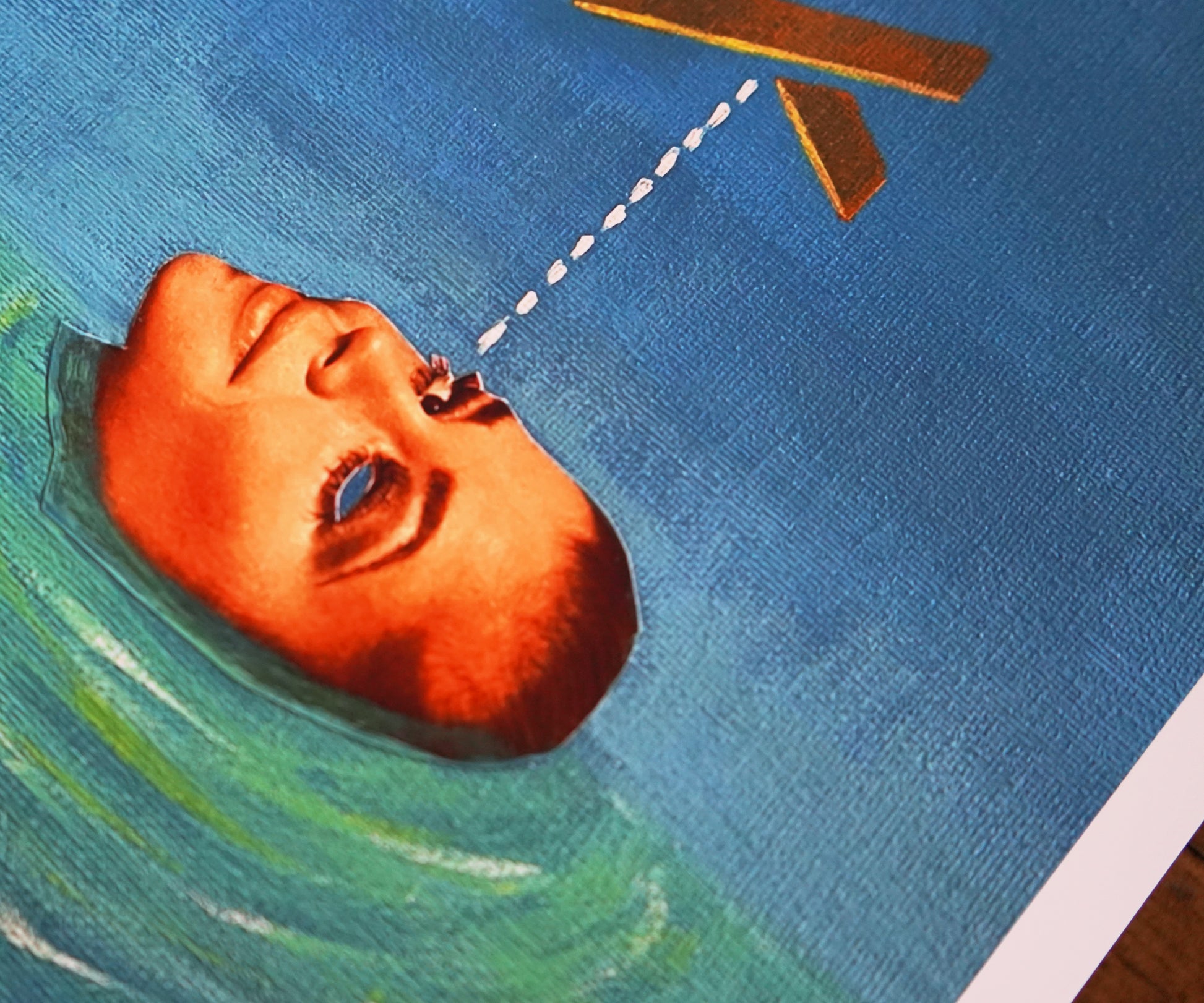 Artistic depiction of a face partially submerged in water with giant X shape overhead