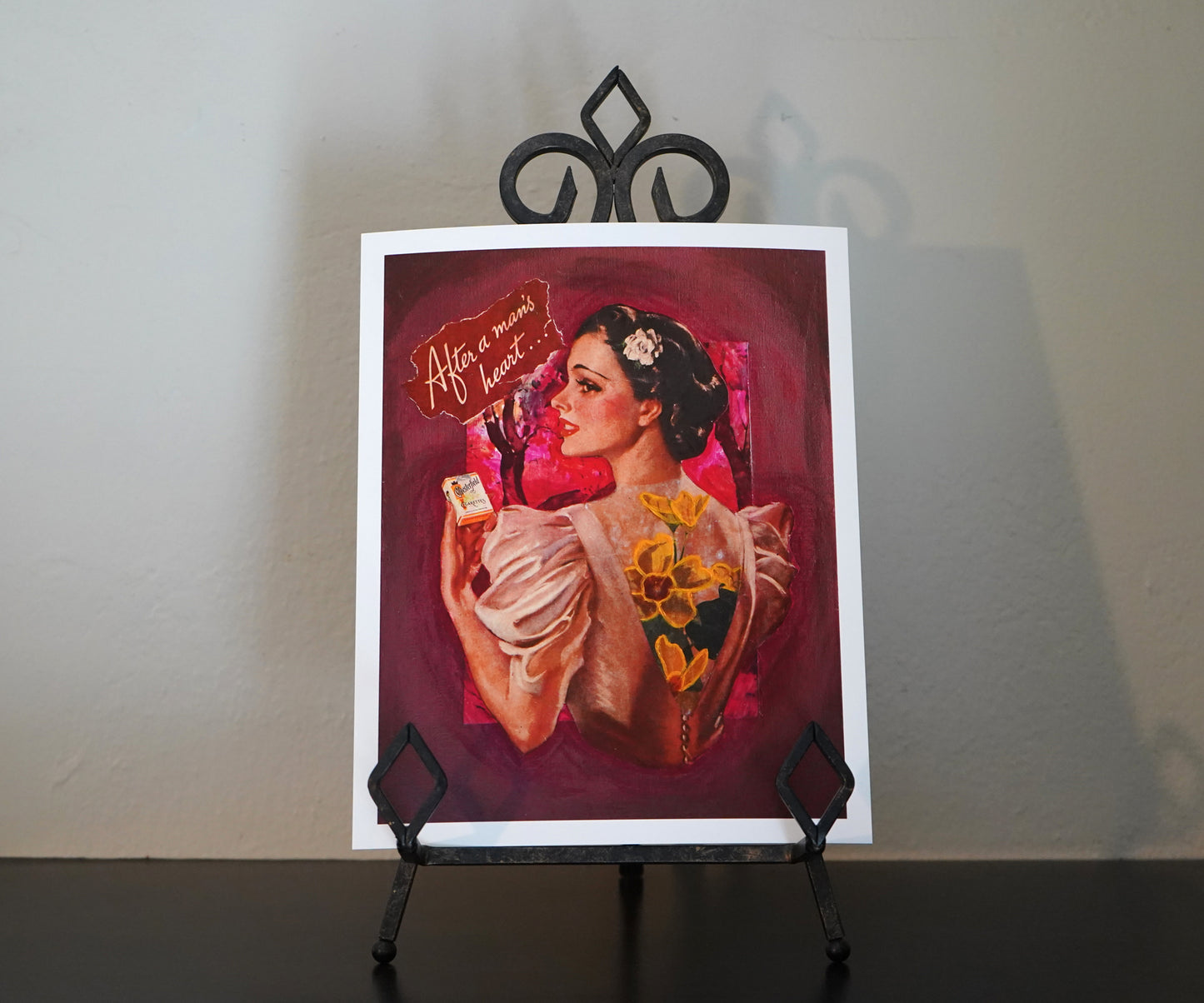 Vintage-style illustration of a woman holding a product with text 'After a man's heart' on a pink background.
