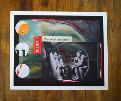 Collage of surreal woman's face and men in a submarine with text and images on a wooden surface