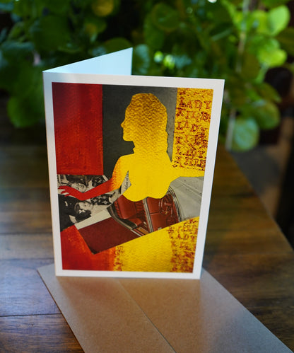 Greeting card with silhouette of awoman in gold and red with the words lady killer lady stamped on the side