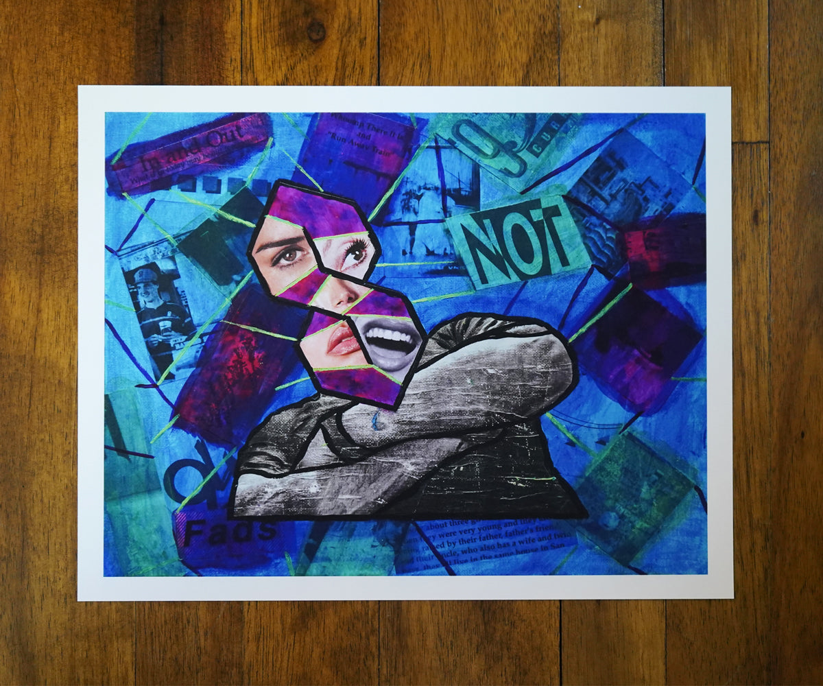Abstract artwork with a stylized face and text on a wooden surface
